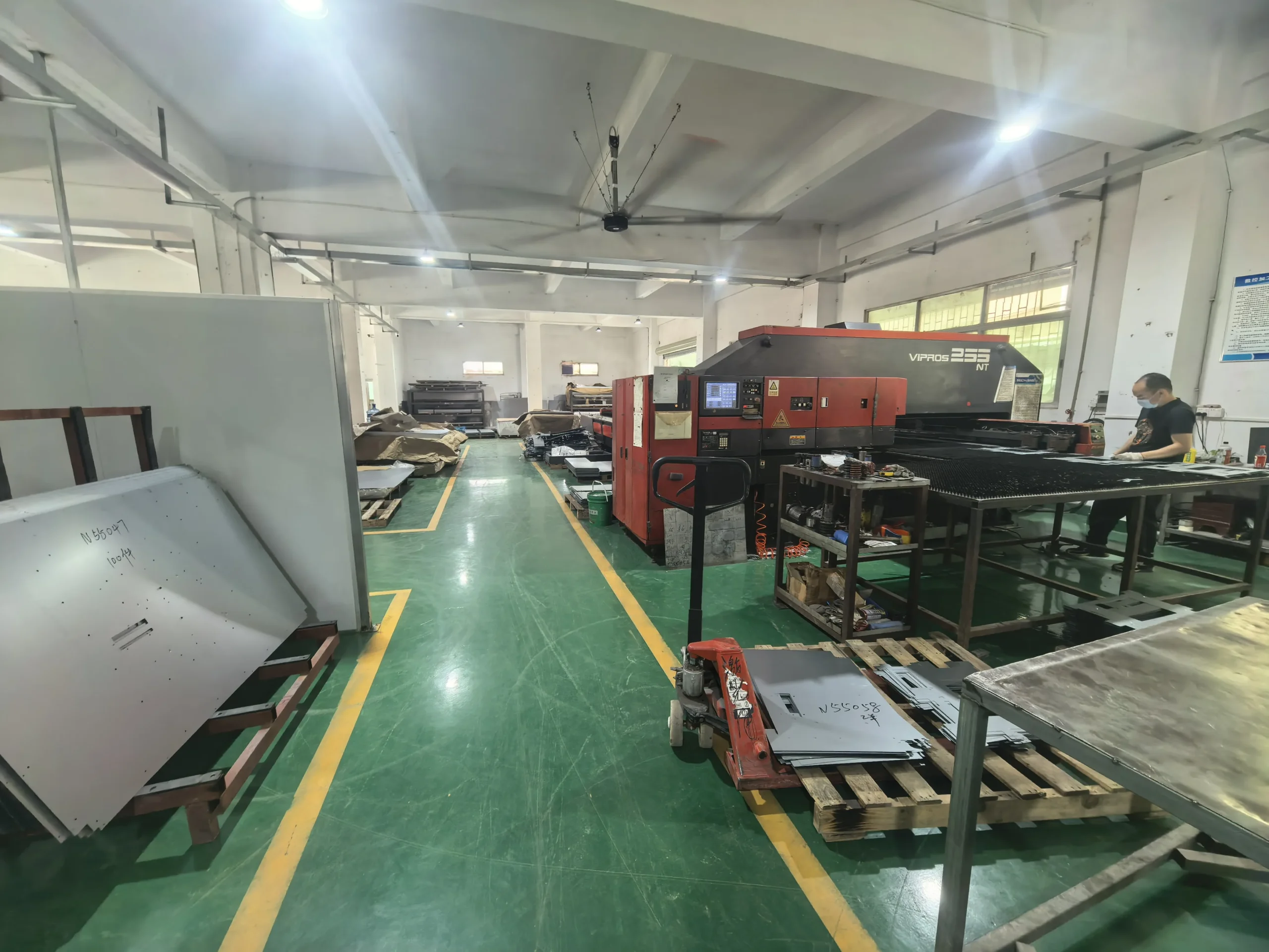 A laser cutting machine processing sheet metal with clean high-precision cutting lines.